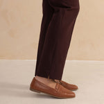 hem details of a tailored aubergine colour pant