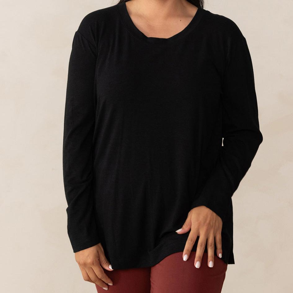 woman wearing a long sleeve scoop neck black top