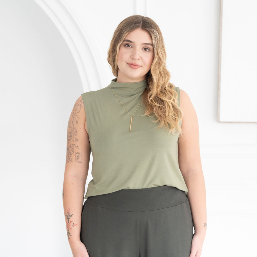 The Going Places Sleeveless Mock Neck