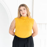 The Going Places Sleeveless Mock Neck