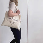 Cream coloured rectangular fabric tote bag with Encircled branding